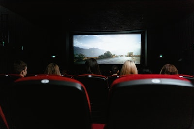 photo of a movie screen from the perspective of someone sitting in the audience
