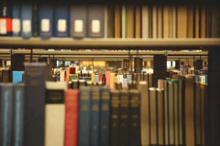 Photo of stacks of books on a shelf