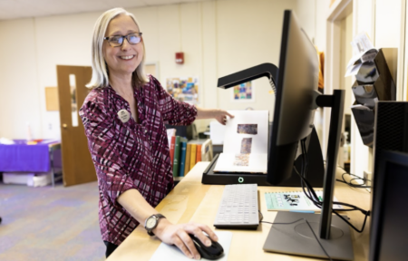 smiling library employee at work